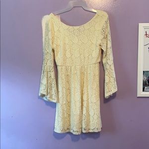 white/beige dress with bell bottom sleeves